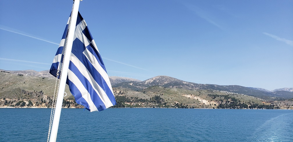 Greece Flag Rear of Boat at Sea